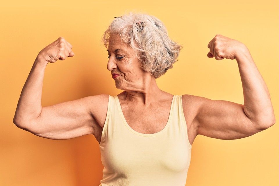 Senior woman flexing biceps